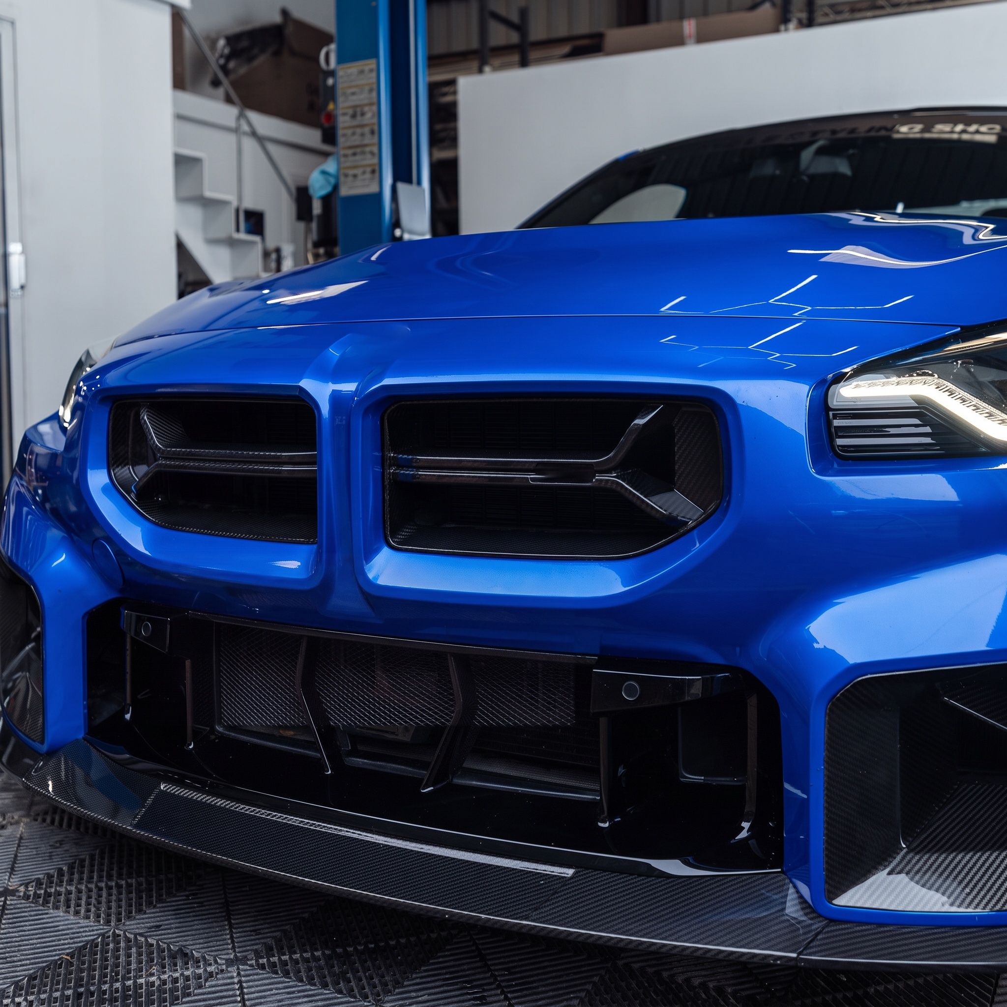 Blue BMW M2 with carbon fibre front parts